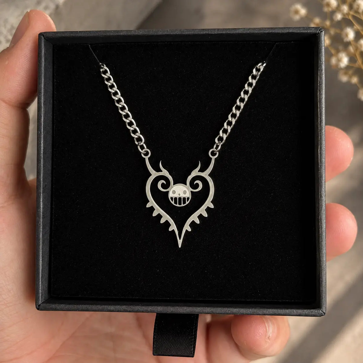 Trafalgar Law Heart Stainless Steel  Necklace from naime One Piece displayed on a black box