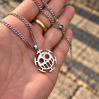 Trafalgar Law Sign Stainless Steel Necklace from anime One Piece held by hand