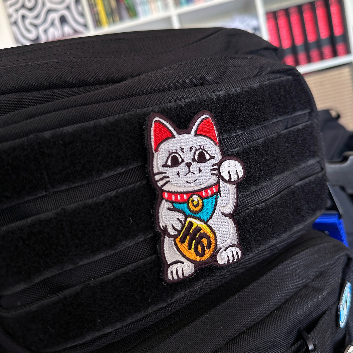 Detail of Turbo Granny Maneki Neko embroidered anime patch inspired by Dandadan with velcro backing – Akira Gallery
