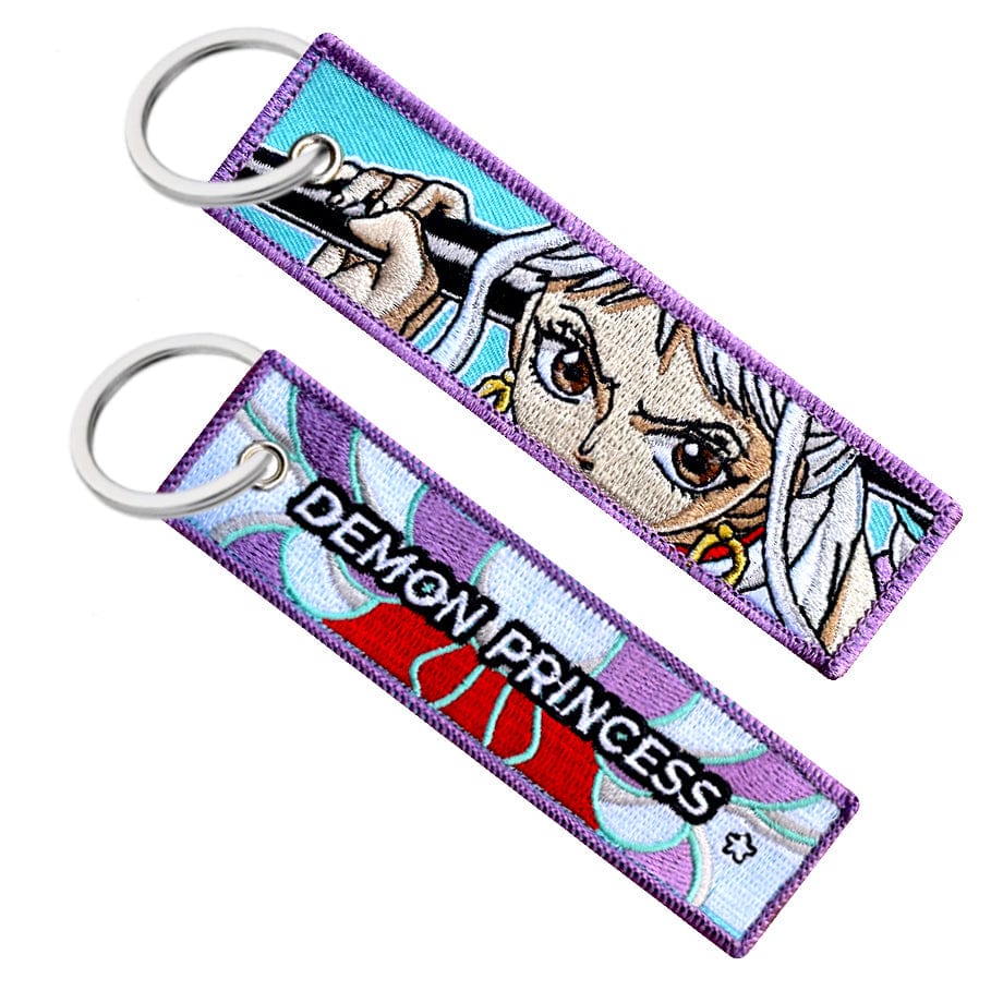 Double-sided embroidered keychain of Yamato from One Piece. One side features the words "Demon Princess" with her kimono pattern, and the other side shows Yamato holding her weapon "Takeru"