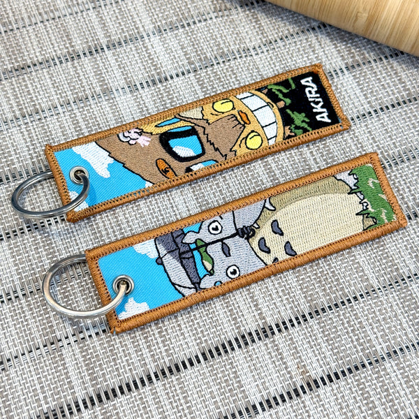 catbus and totoro on a double sided embroidered keychain from studo ghibli