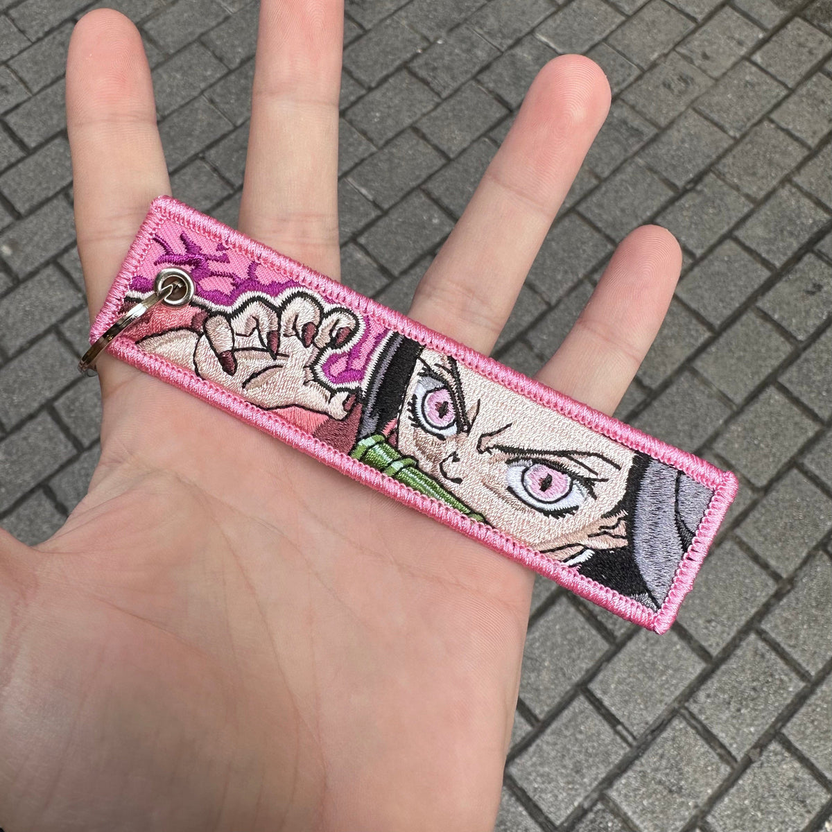 Front view of Nezuko Kamado embroidered keychain – anime keychain – Akira Gallery
