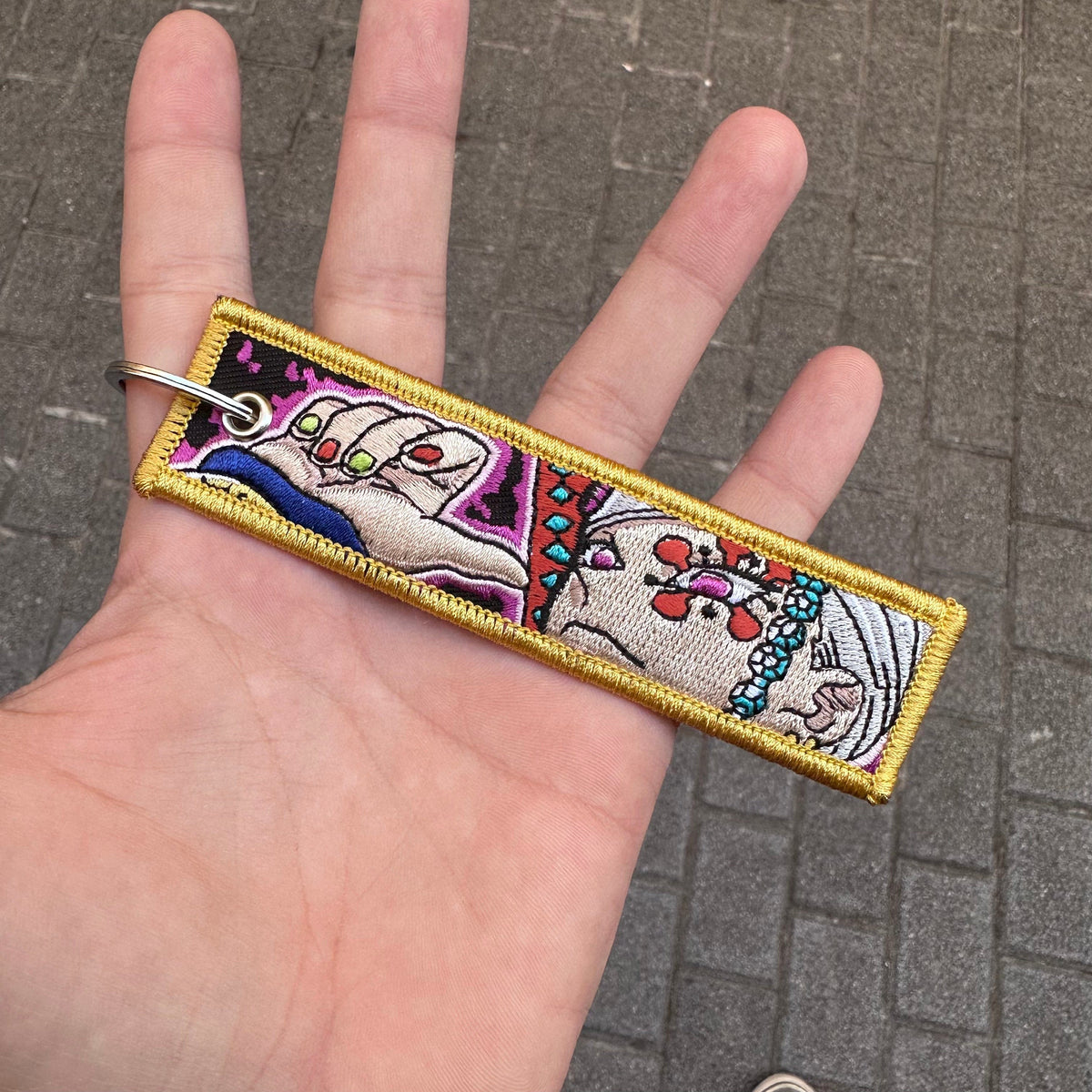 Front view of Tengen Uzui embroidered keytag – anime keychain – Akira Gallery
