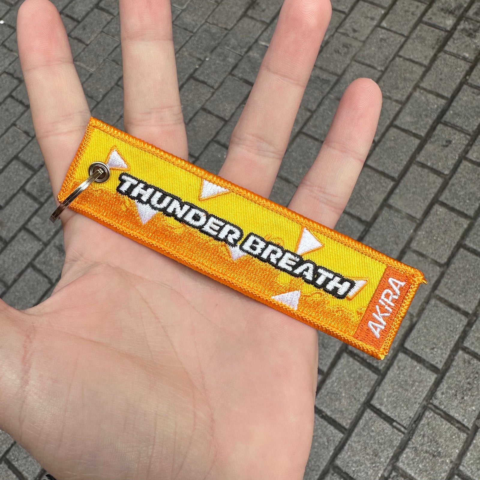 Back view of Zenitsu Agatsuma embroidered keychain – anime keychain – Akira Gallery
